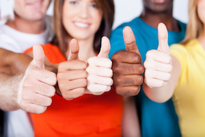 group of multiracial friends thumbs up